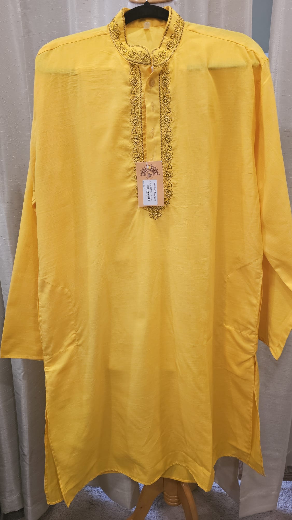 Plain yellow kurta with Black design around the neck(c)